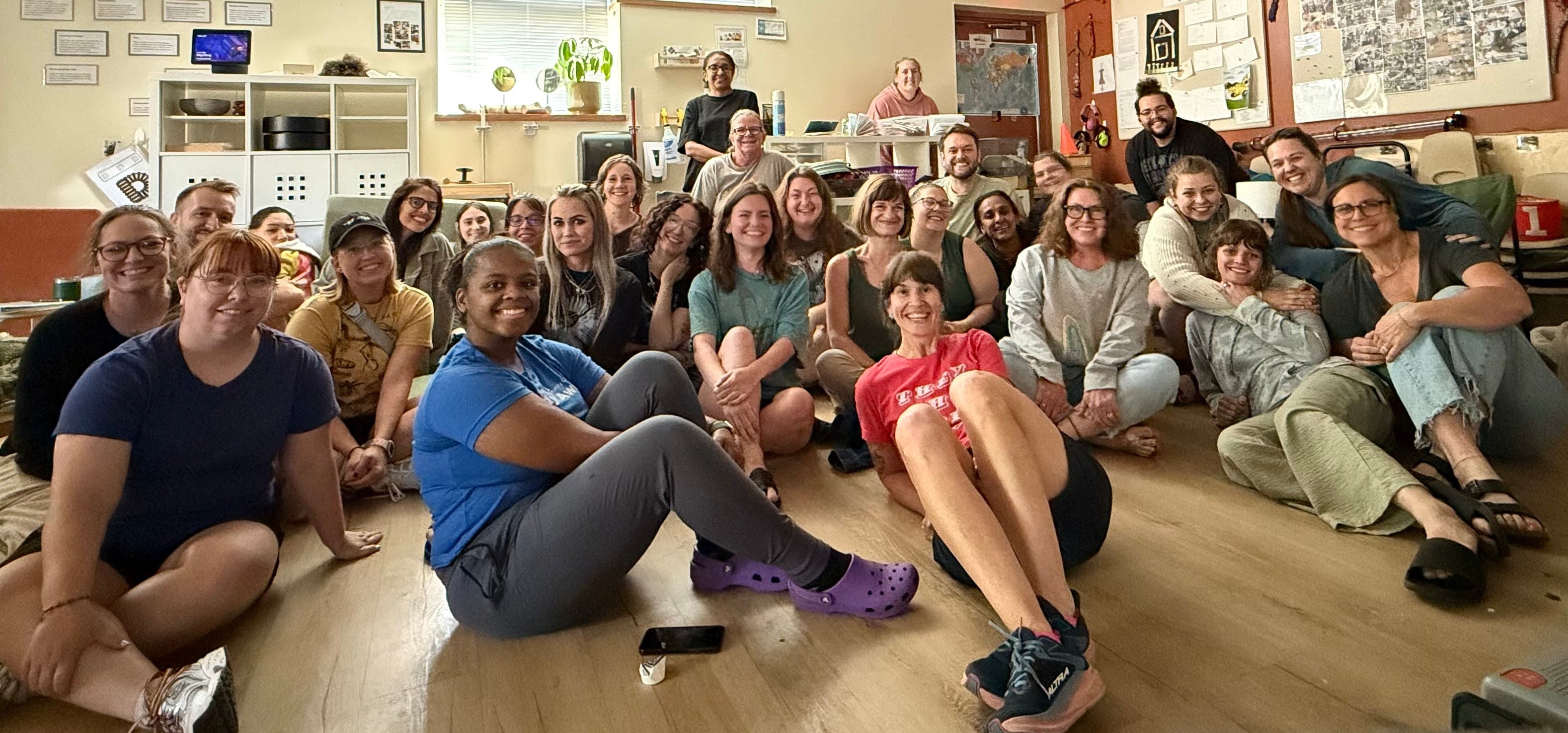 Teachers at a ECE school posing with Brittany after the teacher regulation training.